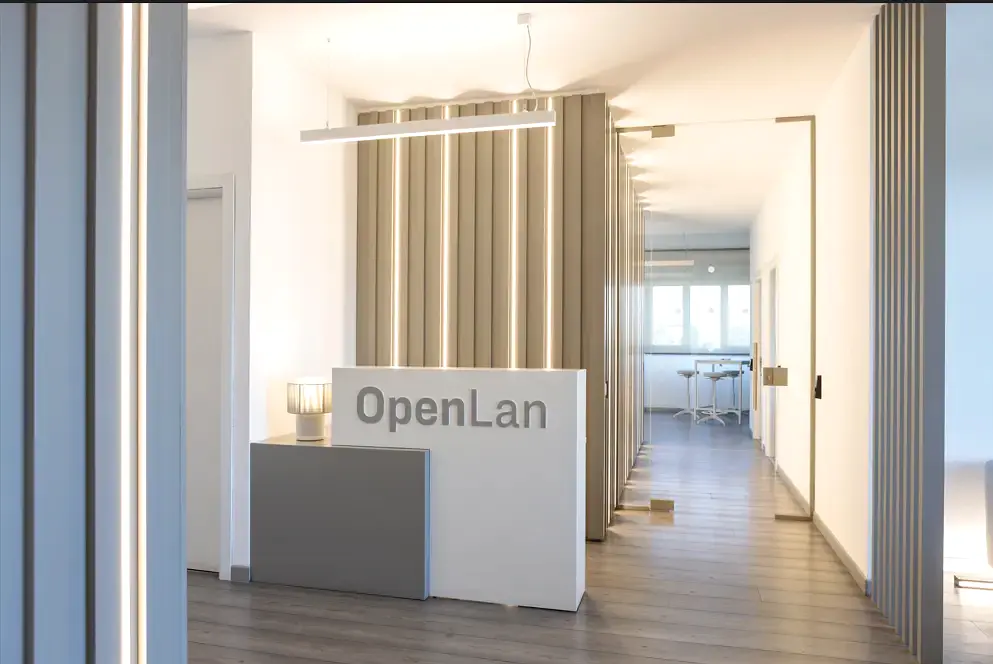 OpenLan office with the company logo and working spaces